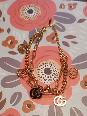 Gold Tone Double-Chain Charm Bracelet with Interlocking G Charms